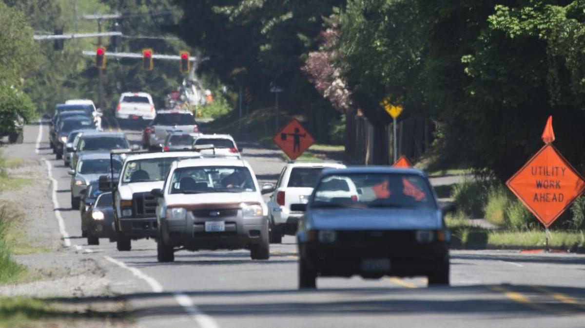 Traffic fills busy Shaw Road in Puyallup on May 23. Work to the once rural roadway between 23rd Avenue and Manorwood Drive has been postponed until May 2018. The project will widen the street with turn lanes, sidewalks and a trail.