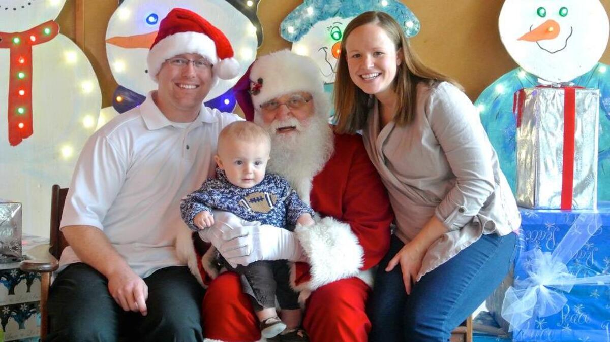 The annual Breakfast with Santa gets the entire family involved in holiday fun. One family gathers for their portrait with Santa at last year’s event.