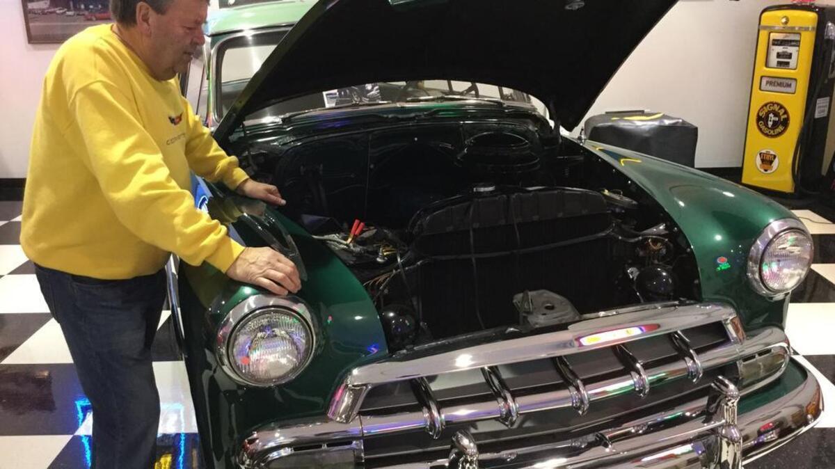 Former Sunset Chevrolet owner and Lake Tapps resident Jerry Yoder looks over his 1952 Chevrolet, the very car he owned and drove when he attended Sumner High School. Yoder has an extensive collection of classic cars which he stores at his Lake Tapps compound.