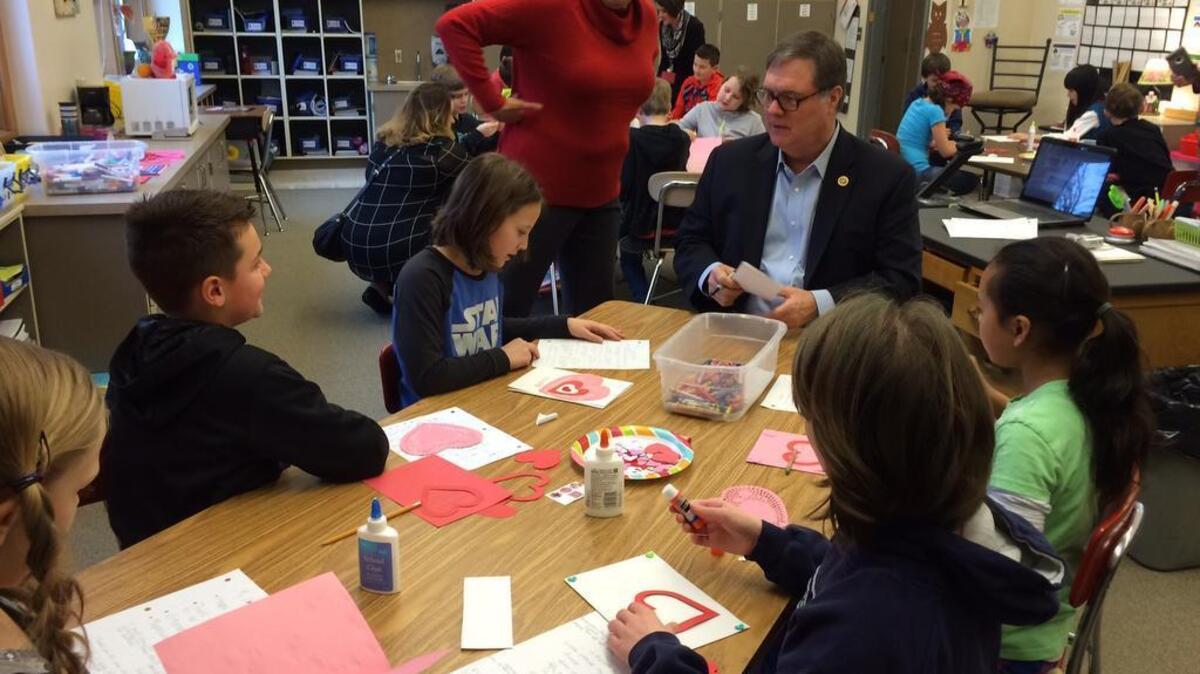 U.S. Rep. Denny Heck, D-Olympia, visits with fourth-graders at Maplewood Elementary School in Puyallup on Friday while teacher Hope Ernst looks on. Heck was on hand to collect handmade cards from students to distribute to local veterans and active service members as part of his Valentines for Veterans drive.