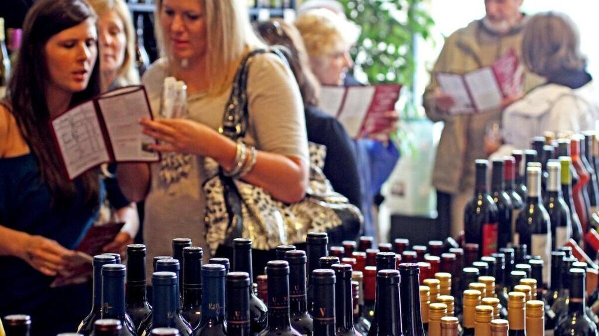Corkscrew Cellars was packed with wine people looking for taste of fine wine Saturday , October 1, 2011 in Puyallup during the Art & Wine Walk .