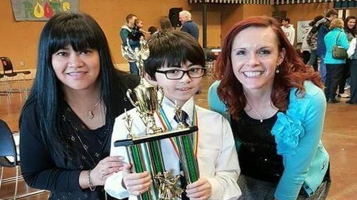Almai Malit-Idler, a former Wildwood principal, left, student Alex Idler and dancing instructor Erin Briones pose for a picture at the Colors of the Rainbow performance last fall.