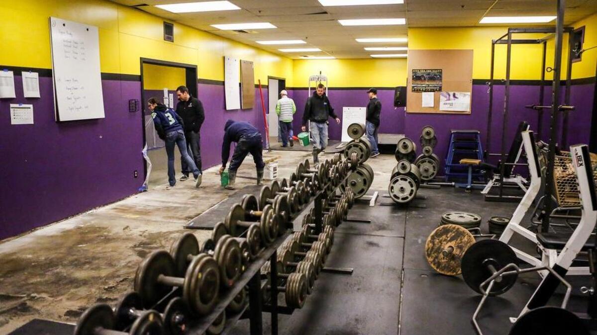 Students and staff members check out the weight room at Puyallup High School in on Friday. The Puyallup Vikings Touchdown Club is spearheading an effort to begin renovations on the high school’s weight room for athletic and student use.