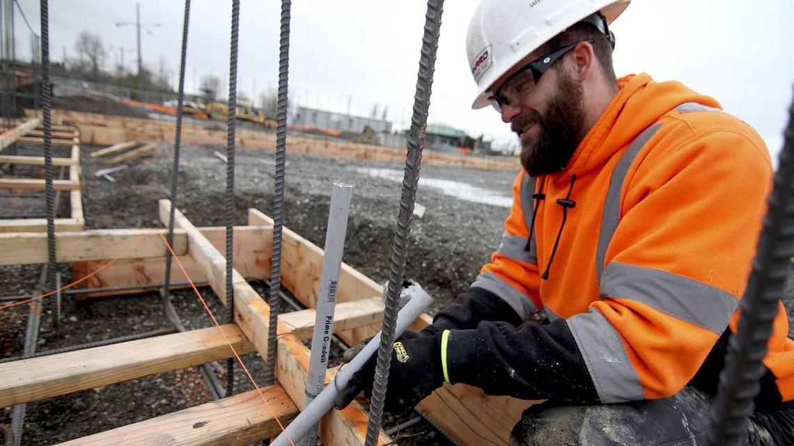 Brent Eccles, of Danard Electric Inc. of Puyallup, installs electrical conduit into the foundation forms for spaces which will soon be filled with concrete at the AgriPlex site at the Washington State Fair Events Center.