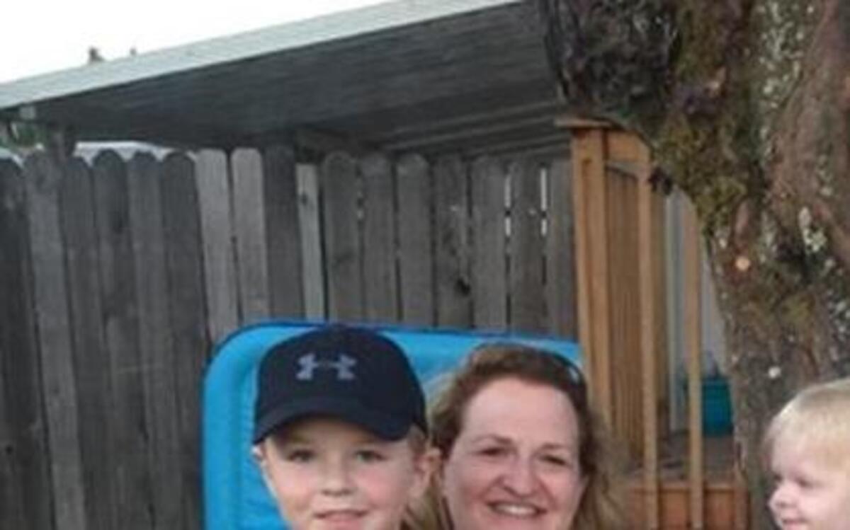 
Megan and Rob Gallwas were instrumental in starting a block watch for their neighborhood, following repeated criminal activity in their cul-de-sac. The couple pose with their children, Brennan 5, and Emerson 2, outside their home in Puyallup. 

