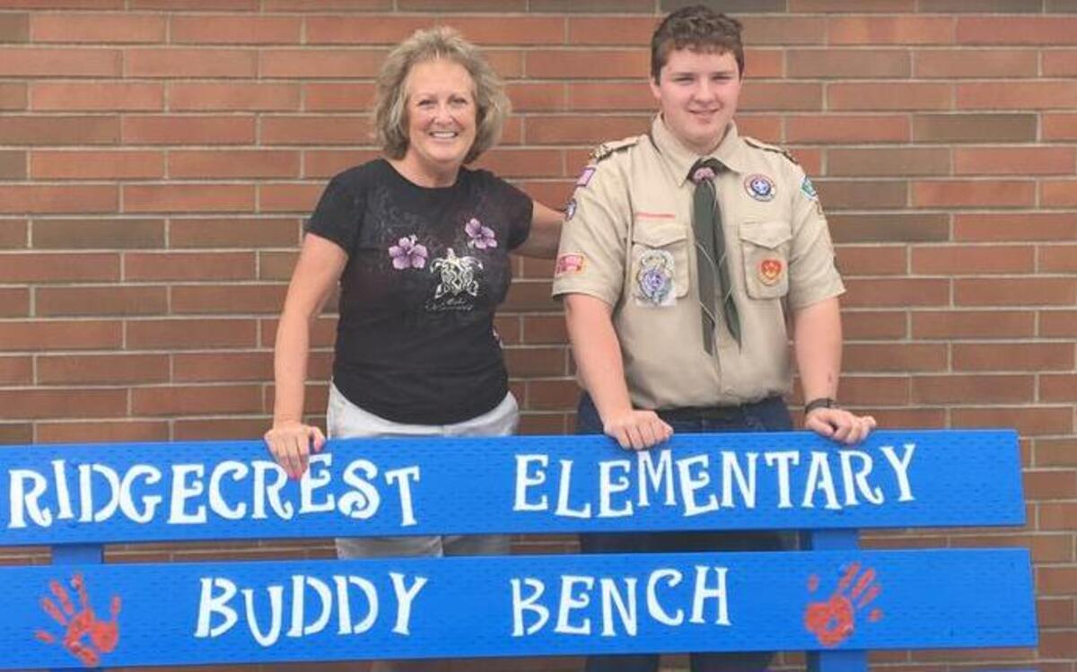 Ridgecrest Elementary teacher Laurie Laramie, left, worked with Colin Norris-Beesley to get his Buddy Bench on campus.
