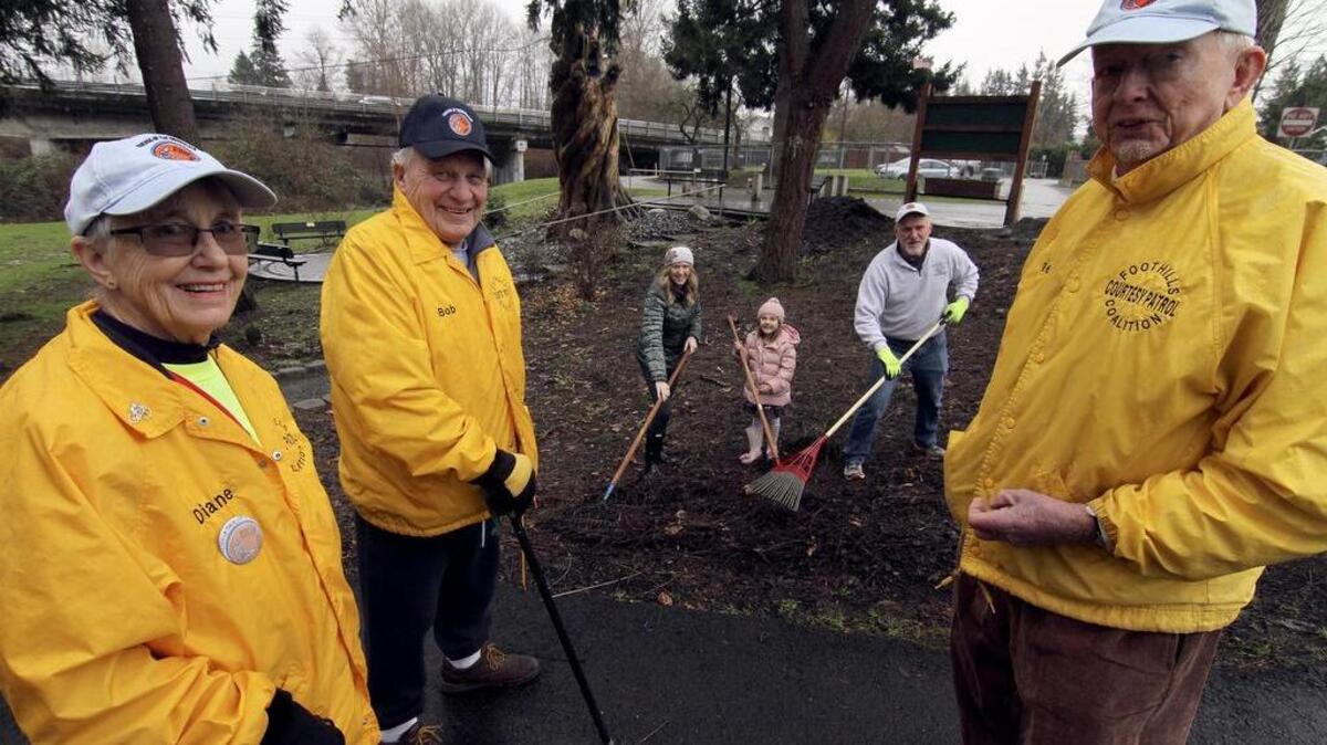 Friends of the Puyallup Riverwalk Trail volunteers Diane and Bob Kastama, left, Nicole and Bella Rose Martineau, Bill Hilton and Ernie Bay are dedicated to keeping the trail and open spaces near the Puyallup River looking beautiful for visitors.