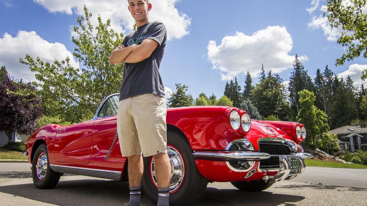 Blake Nelson stands near his 1962 Corvette in the driveway of his family’s home in Puyallup. Nelson inherited the car from his grandfather, Paul Gaetz, after he died from brain cancer in 2009. “It’s cool having something that reminds me of him all the time,” he said.