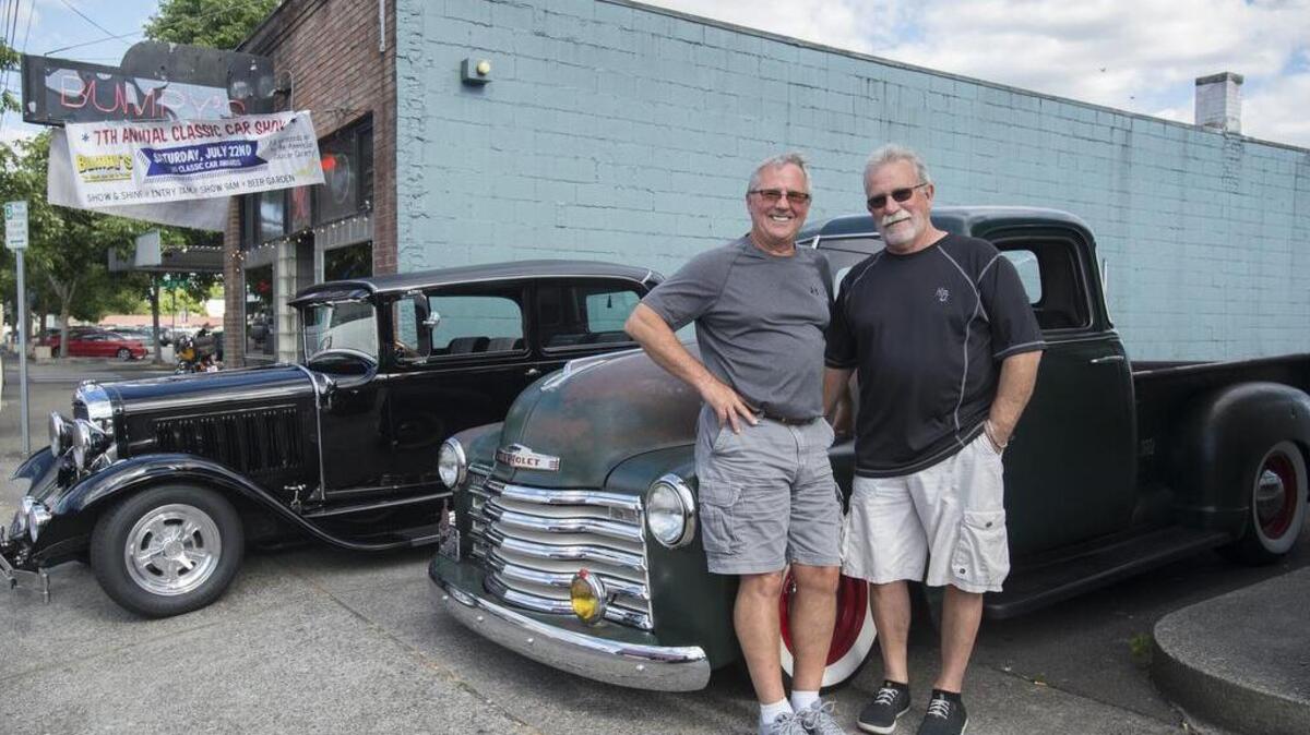Tom Gaetz, left, and his 1930 Studebaker with pal Denny Bisig and his 1949 Chevrolet pickup outside Bumpy’s Tavern in Puyallup on Thursday. The pair — both from Puyallup — have participated in every one of the Bumpy’s Classic Car Shows, now in its seventh year as a fundraiser for the American Cancer Society. The registration for Saturday’s show starts at 7 a.m.