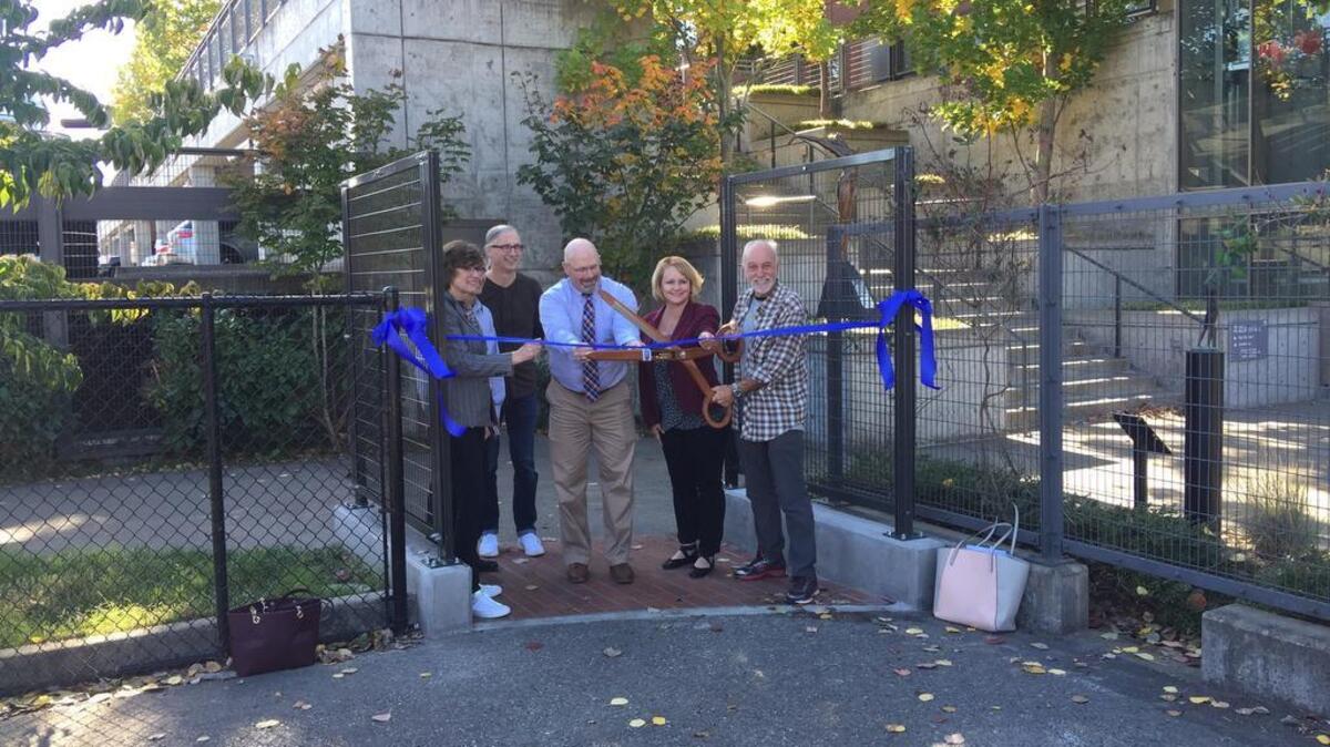 Puyallup School District and city officials cut the ceremonial ribbon to open the pathway between their two buildings on Oct. 16.