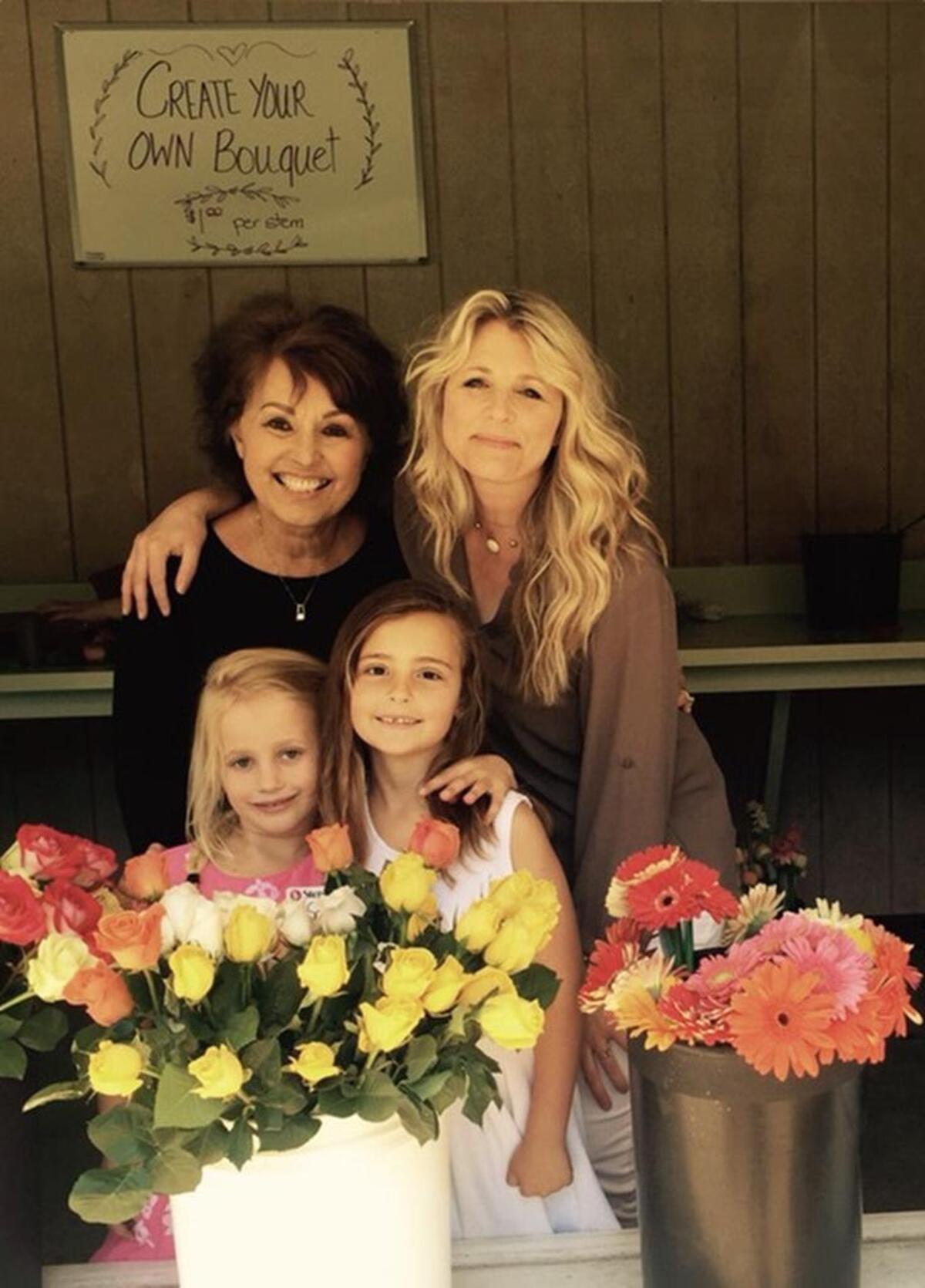 Germaine Korum, left, poses for a picture with her granddaughter, Katie, Step By Step founder Krista Linden and Linden’s daughter, Sofia.