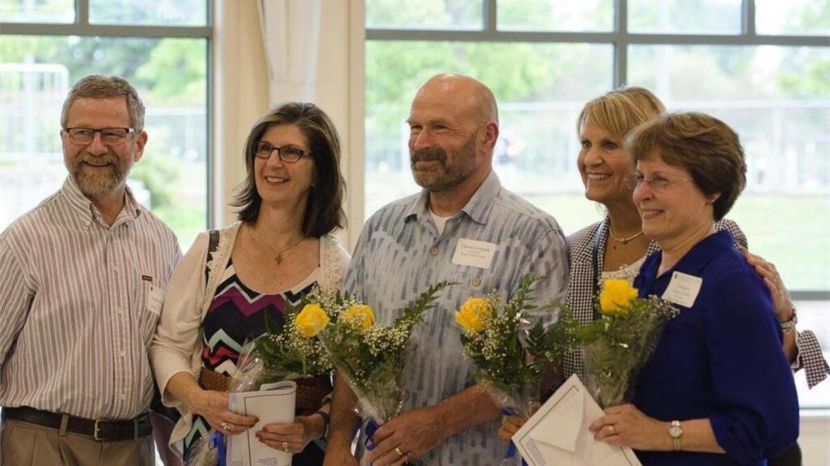 A group of retiring teachers from the Puyallup School District cerebrate their many years of serving students at the June 19 school board meeting.