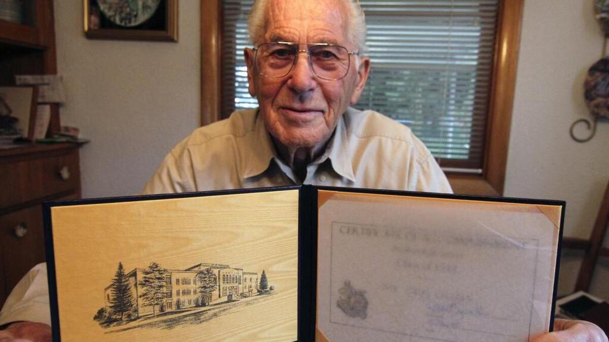 Fife resident Carl Olson, 91, received a certificate to honor his first two years of high school from Puyallup High last week. The Class of 1942 student is proud of the distinction.
