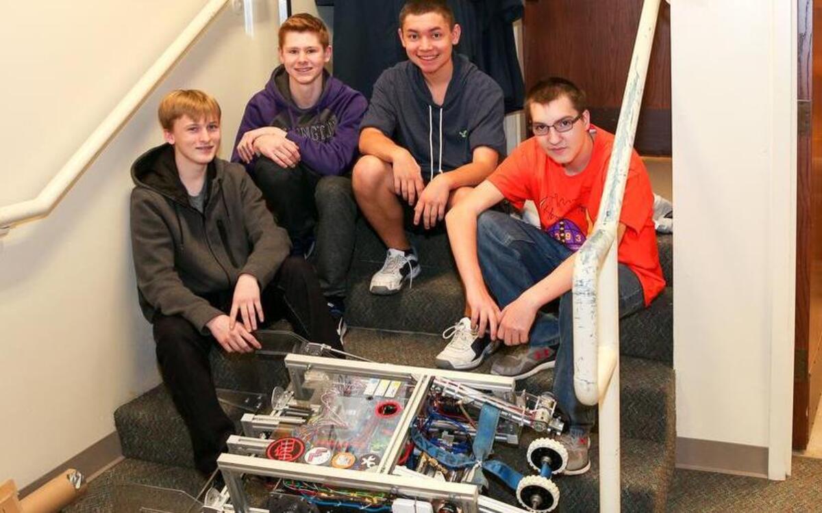 The Puyallup High robotics team, also known as Horns of Havoc 3393, competed April 6-9 at the Washington First Robotics Pacific Northwest Championship in Portland. Brennon McCoy, Matthew Hawley, Tristan Chandler and Hunter Shouse, from left, pose with the team’s robot.