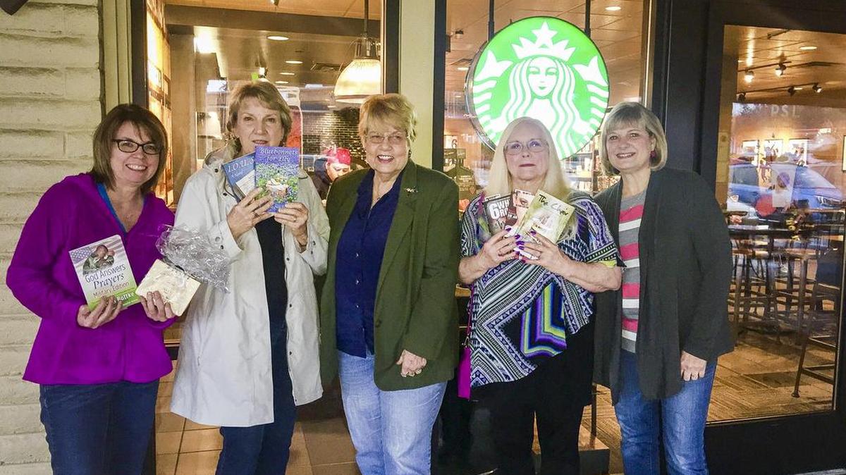 Members of the writer critique group from left: Pamela Johnson, Sandra Nachlinger, Ella Tate, Kelly Marshall and Kathy Guimond stand in front of the Starbucks on South Hill where they meet monthly to discuss their creative writing.