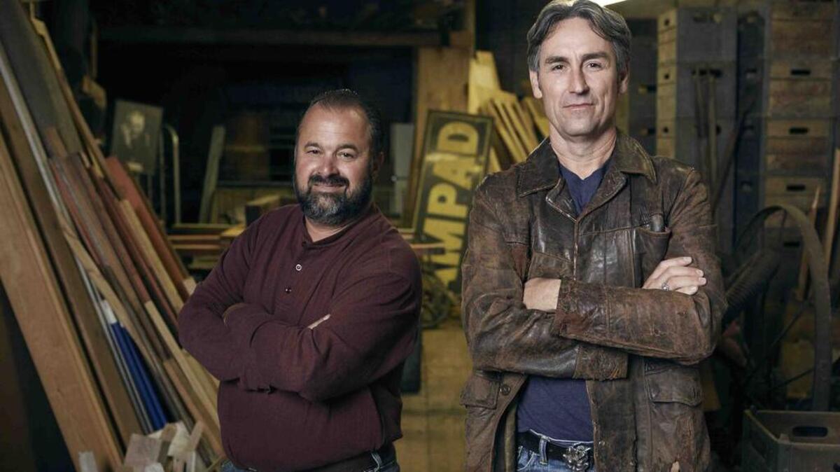 Mike Wolfe, right, and Frank Fritz, the stars of “American Pickers,” travel all over America looking for hidden antique treasures. Their journey brings them to Washington state next month.