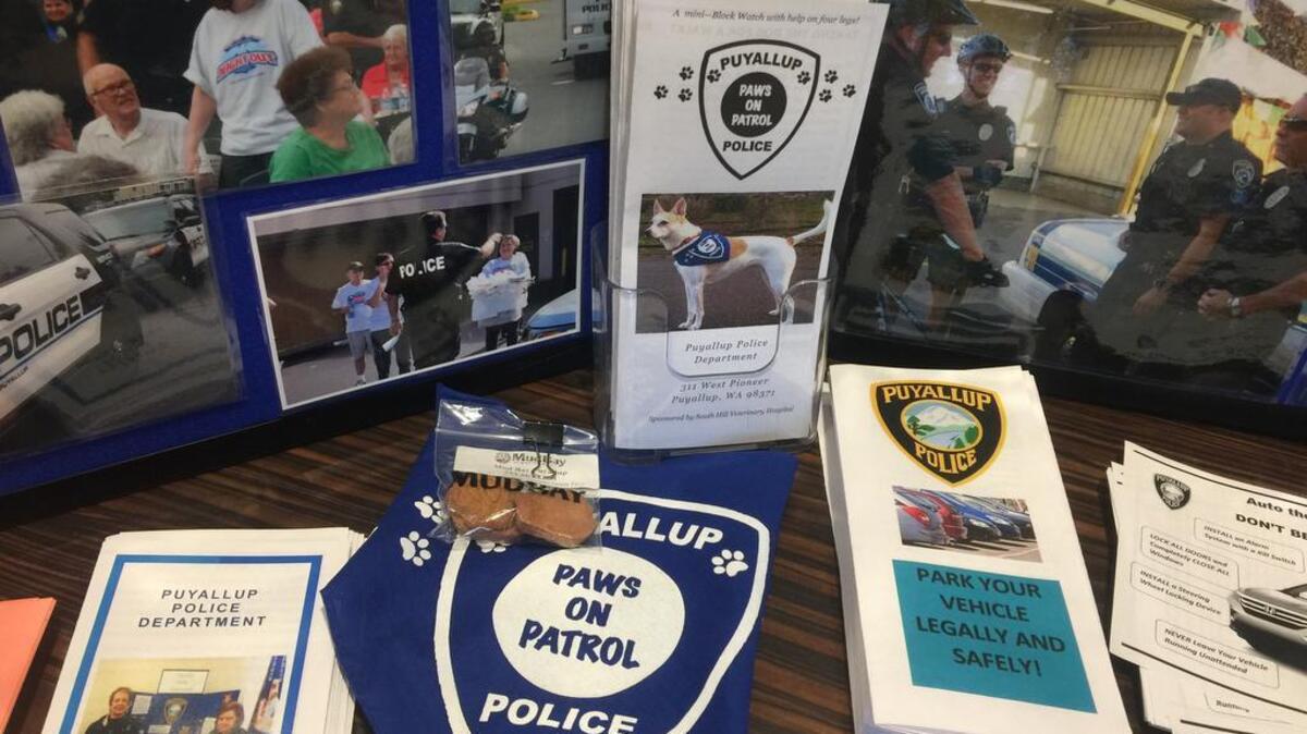 Paws on Patrol scarves and pamphlets were on display at the Puyallup Police Department’s Coffee with a Cop event last week.