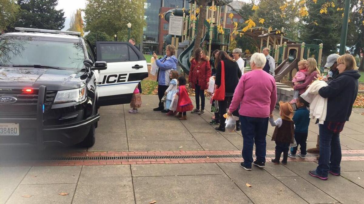 Puyallup police officer Mark Ketter lets children check out his patrol SUV during an event Friday at the Puyallup Public Library. Every year, the department visits with children at the library to share some important do’s and don’ts for Halloween.