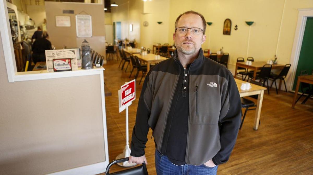 Shaun Brobak stands for a photo at Auntee B’s restaurant in downtown Puyallup. Brobak has taken over ownership of the restaurant and is implementing changes, including menu changes and some freshening up on new paint on the storefront.