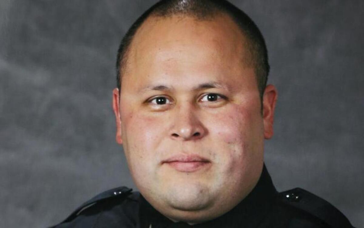 This undated photo provided by the Tacoma Police Department shows officer Reginald “Jake” Gutierrez, who was shot and killed while responding to a domestic violence call Wednesday, Nov. 30, 2016.