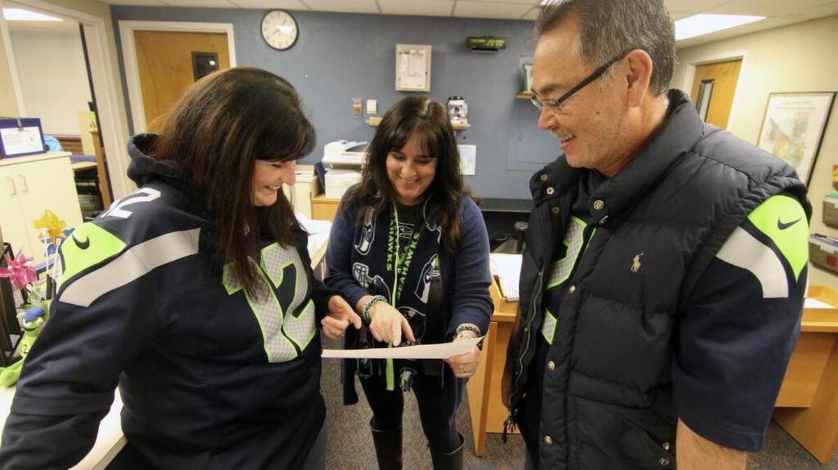 Linda Molinari, left, office manager Carol Howry and Principal Rick Cox chat before the start of school Friday at Waller Road Elementary. Molinari is a para-educator and treasurer of the school’s Parent Teacher Organization. She and other members of the school’s PTO are hosting several fundraisers for the construction of a track at the elementary school.