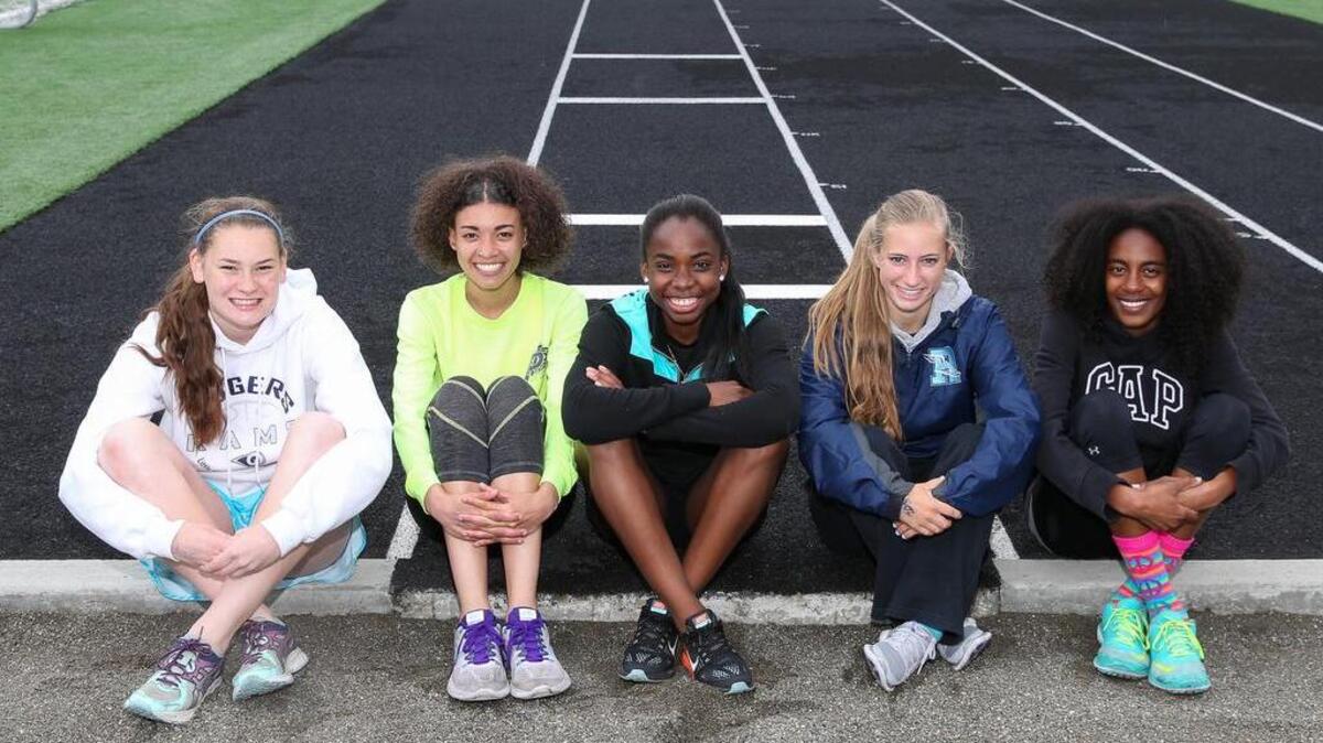 The Rogers High girls relay team members, from left, Kendra Specht, Essence Foster, Jelani Heath, Rebekah Barkley and Destiny Whaley have forged a strong bond so far this season.