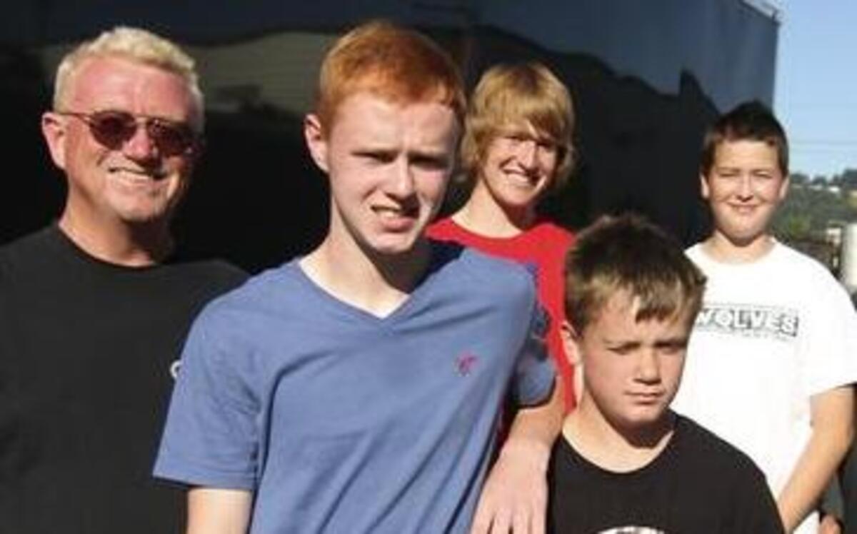 
Brothers Devin, center, and Korban Lewis, second from right, are drag racing drivers in a family that has used motorsports to bring it closer together. 
