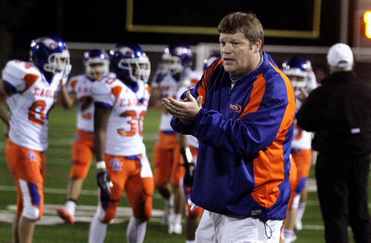 Graham-Kapowsin High coach Eric Kurle prepares to talk to his players after a game at Sparks Stadium in 2010. Sept. 22 was the first meeting between Keith Ross’ Sumner Spartans and Eric Kurle’s Graham-Kapowsin Eagles, a first-ever 4A South Puget Sound League meeting, and one with potential league title implications on the line.
