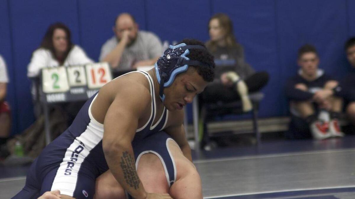Rogers’ Wyatt Urps looked dominant in his 152-pound championship as he out-muscled Bellarmine Prep’s Tim Jensen into a pinfall.