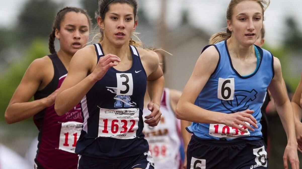 Rogers High’s Malaina Thacker, center, competes in the 1,600-meter during Star Track XXXIV at Mount Tahoma High School on Saturday.