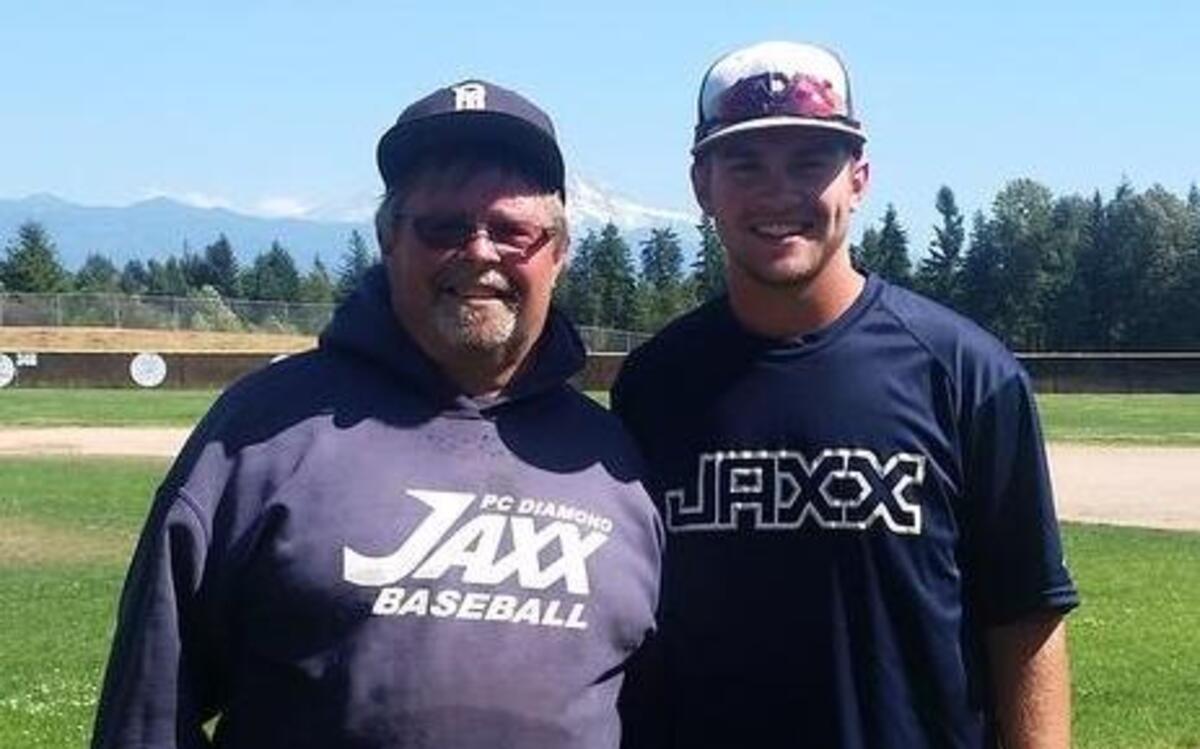 
Former Bonney Lake High baseball player Stephen Hansen stands with his father, Mark, who has worked as the groundskeeper at the school’s baseball field for the last few years.
