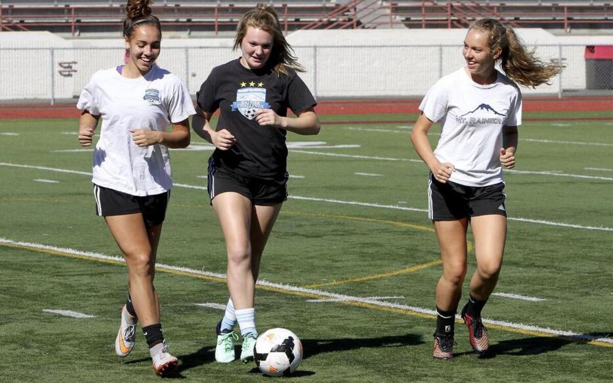 
Puyallup High girls soccer team captains Saige Lyons, Jordan Bartelson and Cassie Wolter, from left, will be key players for the Vikings this year as they try to capture their second SPSL South title under coach Matt White.
