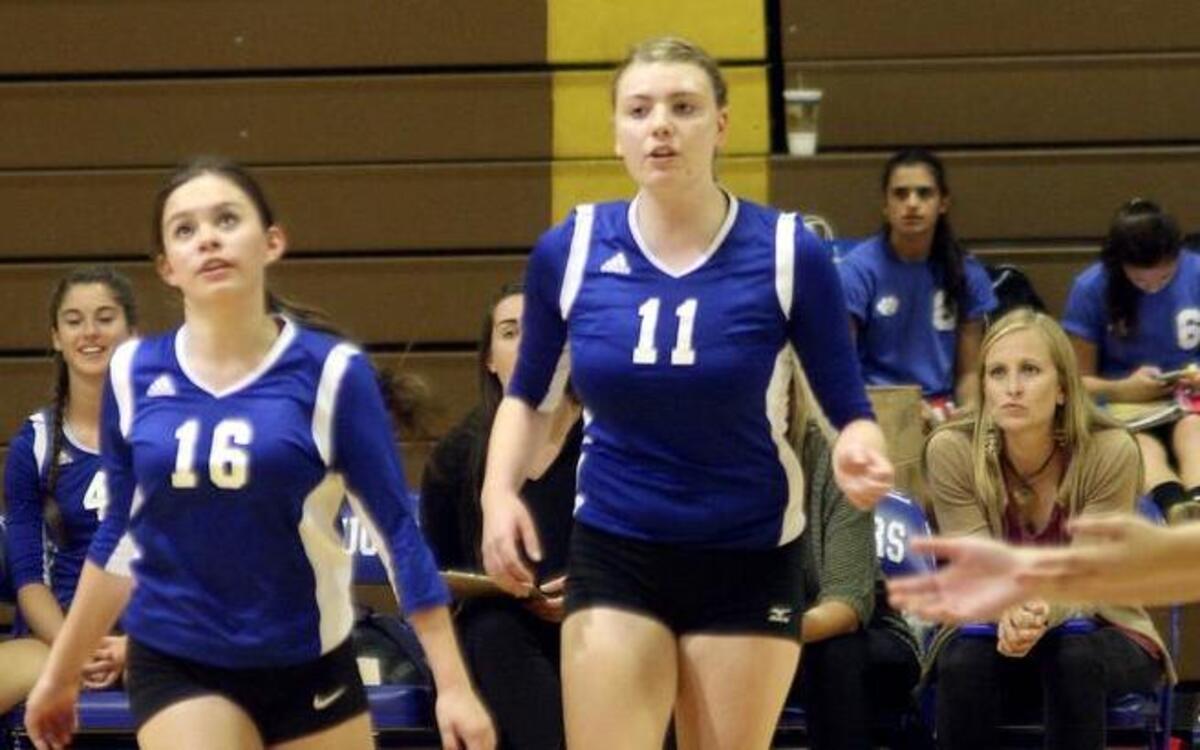 
Senior Dani Tang, center, has become the Cascade Christian High volleyball team’s leader both spiritually and on the court.
