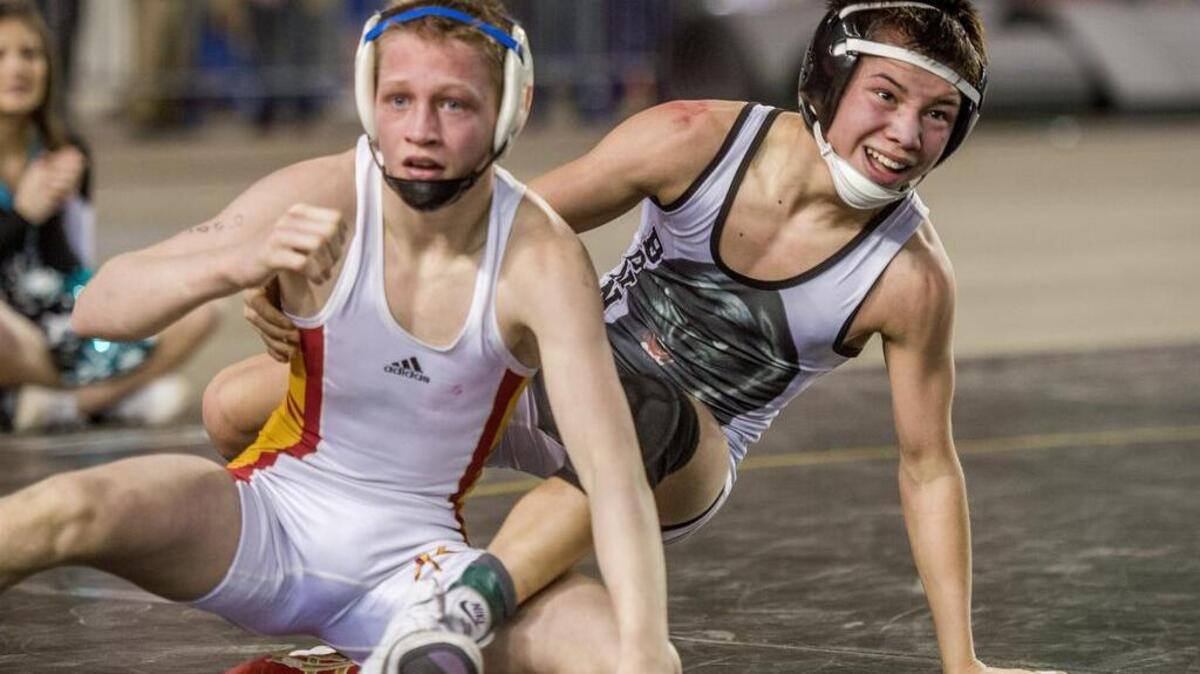 Brandon Kaylor of Bonney Lake High, right, grins after winning a match against Kamiakin’s Riley Gurr last year at Mat Classic. Kaylor was recently named an All-American at the ASICS/Vaughan Cadet and Junior Nationals last month in Fargo, North Dakota.