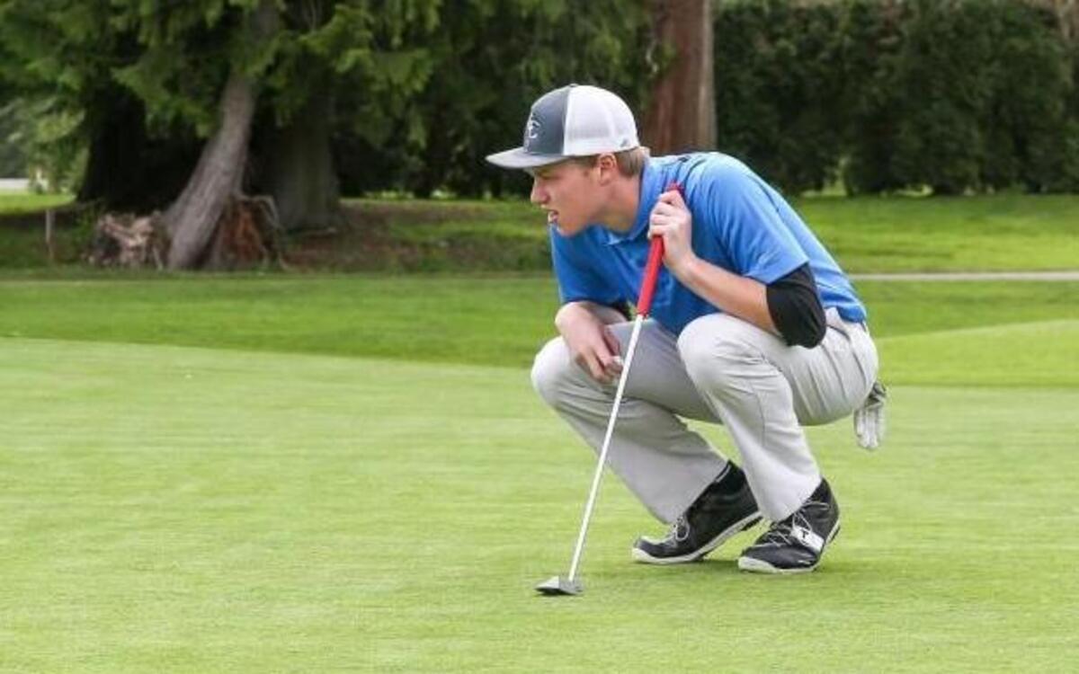 Cascade Christian High golfer Dyllan Gritter lines up a putt last week during a practice round at High Cedars Golf Course in Orting. Gritter has averaged 76 strokes per 18 holes and has won three medals in five matches this year.