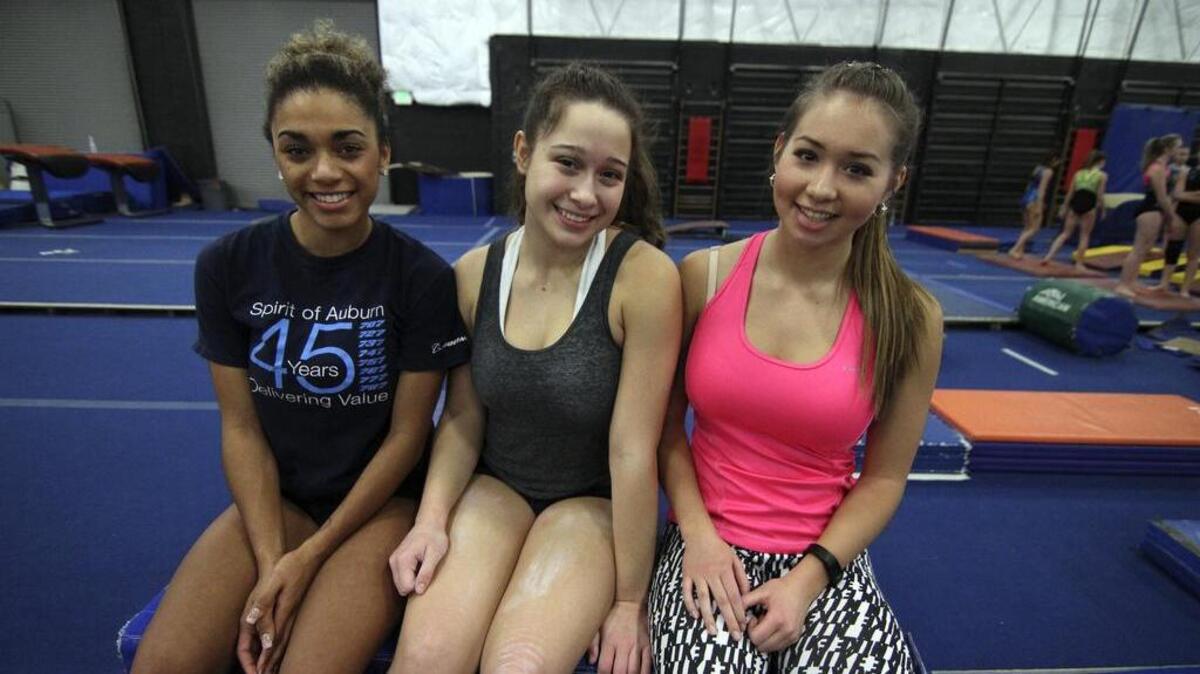 Bonney Lake High all-around gymnastics team members Aleah Newborn, Lauren Waters and Nikole Otto, from left.