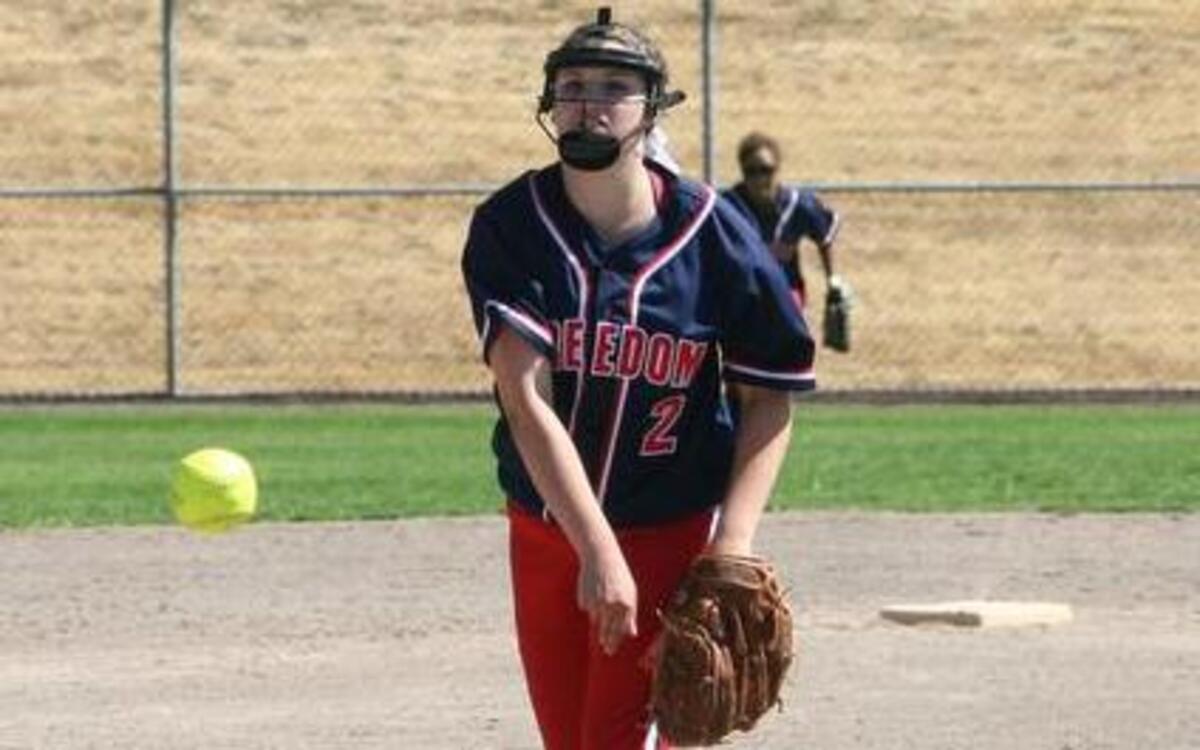 
Puyallup High senior Emilee Buckles, pictured here playing for Freedom Fastpitch, a Pierce County-based club team, throws a pitch Saturday at a tournament in Auburn. Buckles plays softball despite suffering from cystic fibrosis. 
