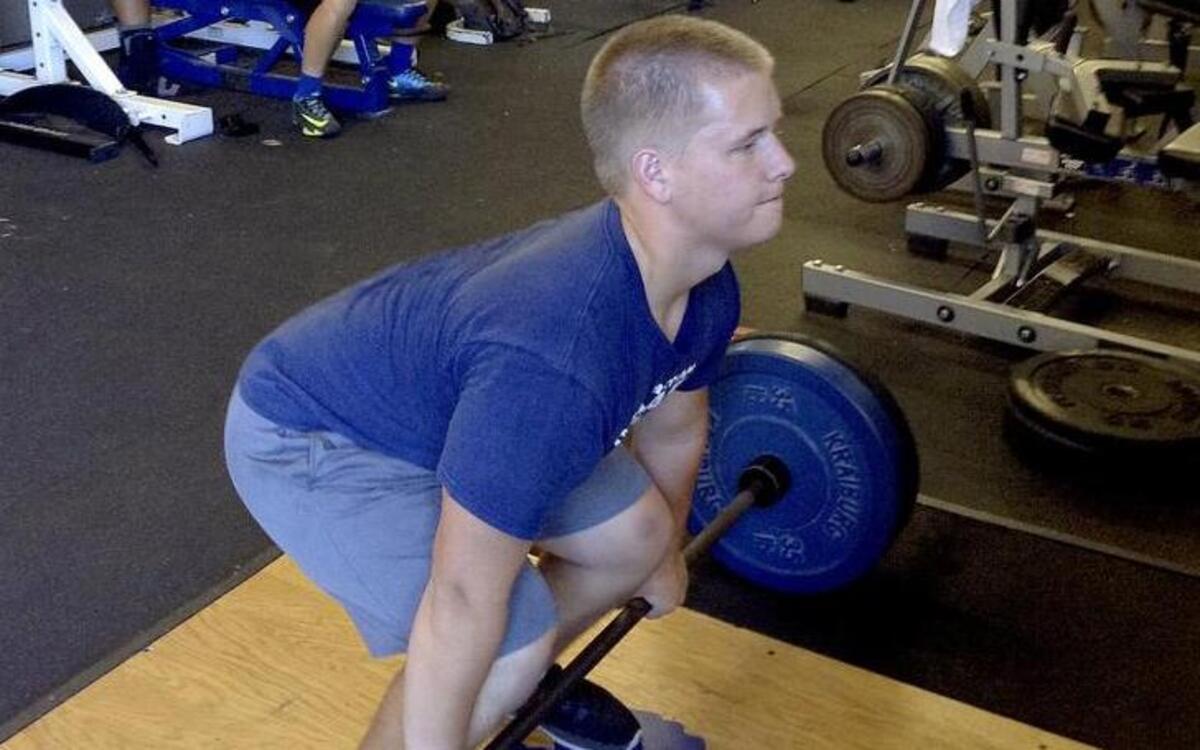 
Cascade Christian High senior Jared Flattum takes his time while lifting weights last week during an offseason session at the high school.
