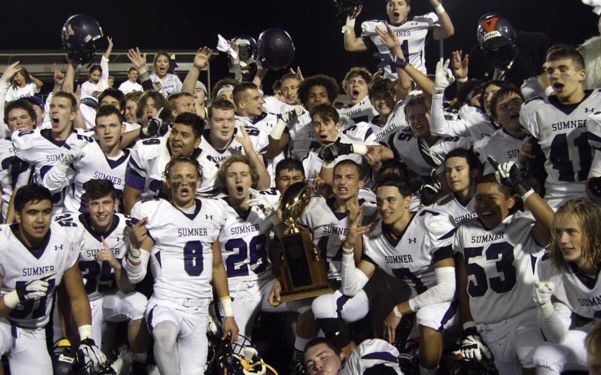 The Sumner Spartans celebrate Friday’s victory over rival Bonney Lake in the 2015 Sunset Bowl. The win gave the Spartans the Class 3A South Puget Sound League title.