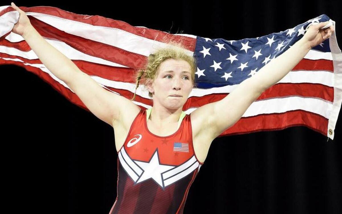 
Puyallup High grad Whitney Conder of the United States reacts with her county's flag after defeating Mexico's Alma Valencia in the Women's freestyle 53kg gold medal wrestling match during the Pan Am Games in Toronto on July 16. Conder won the gold medal. 
