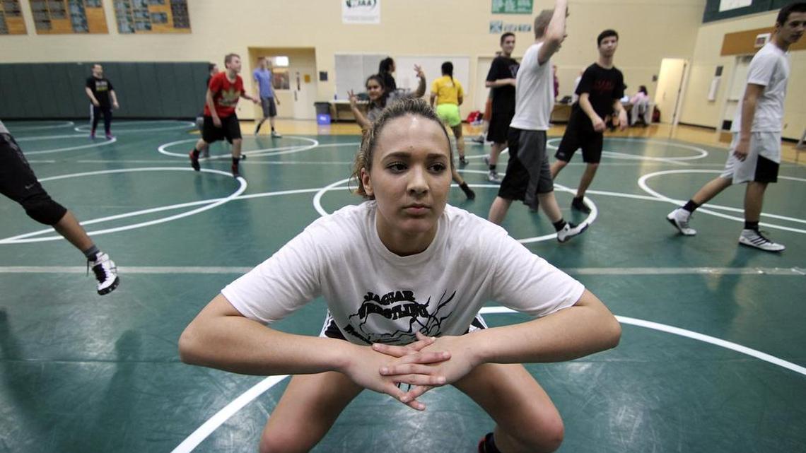 Emerald Ridge High wrestling team captain Kendra Maxfield leads her teammates in a workout last month. Despite losing her grandfather to cancer in January, Maxfield overcame her grief to earn a fifth-place finish in the girls 170-pound bracket at Mat Classic XVIII last month.