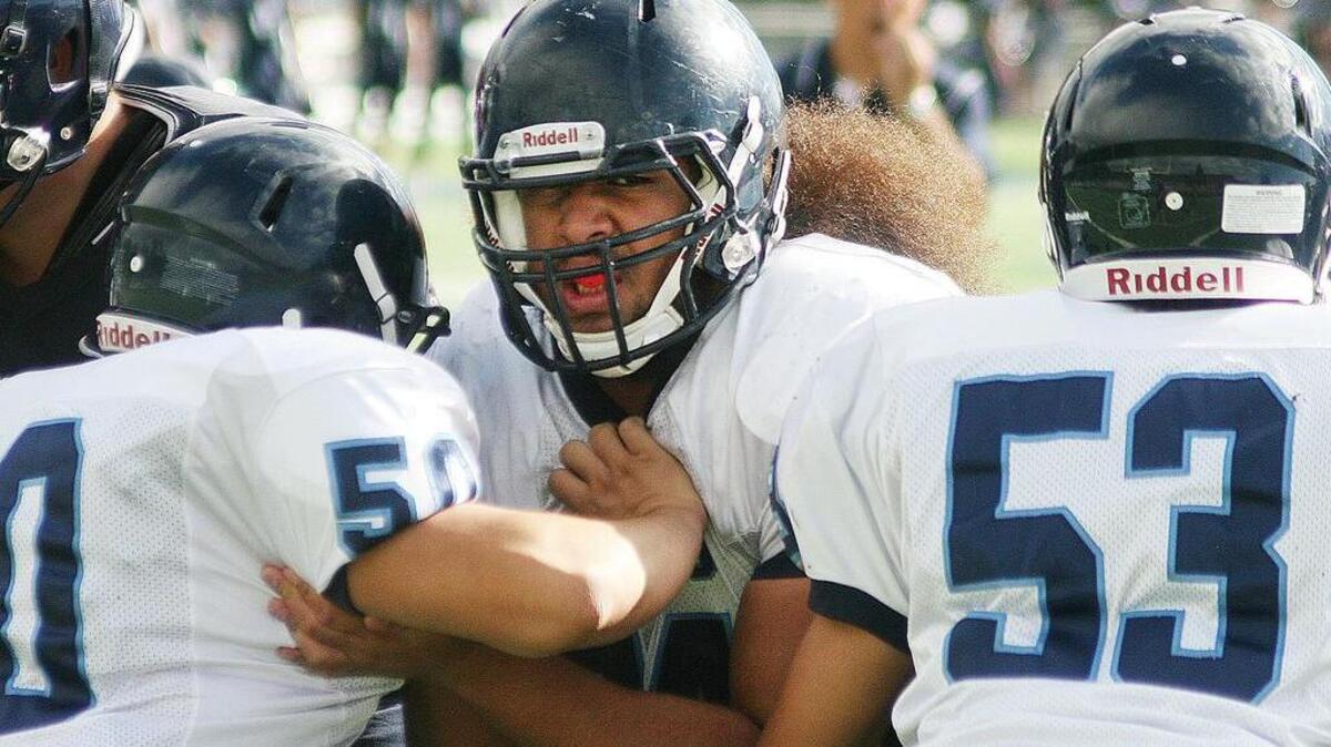 Rogers High’s tackle Michael “Big Mike” Fifita is one of the area’s largest defensive linemen, standing 6-foot-2 and 305 pounds.