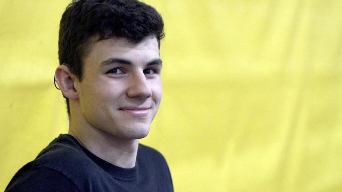 Josh Franich, a wrestler at Puyallup High School, is hearing impaired and uses a device to hear out of his right ear only.