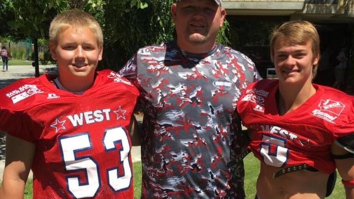 Cascade Christian’s Peyton Berry, right, and Jared Flattum, left, were selected to play in the Earl Barden East-West All-Star Classic in Yakima. Brian Flattum, center, coached in the game.