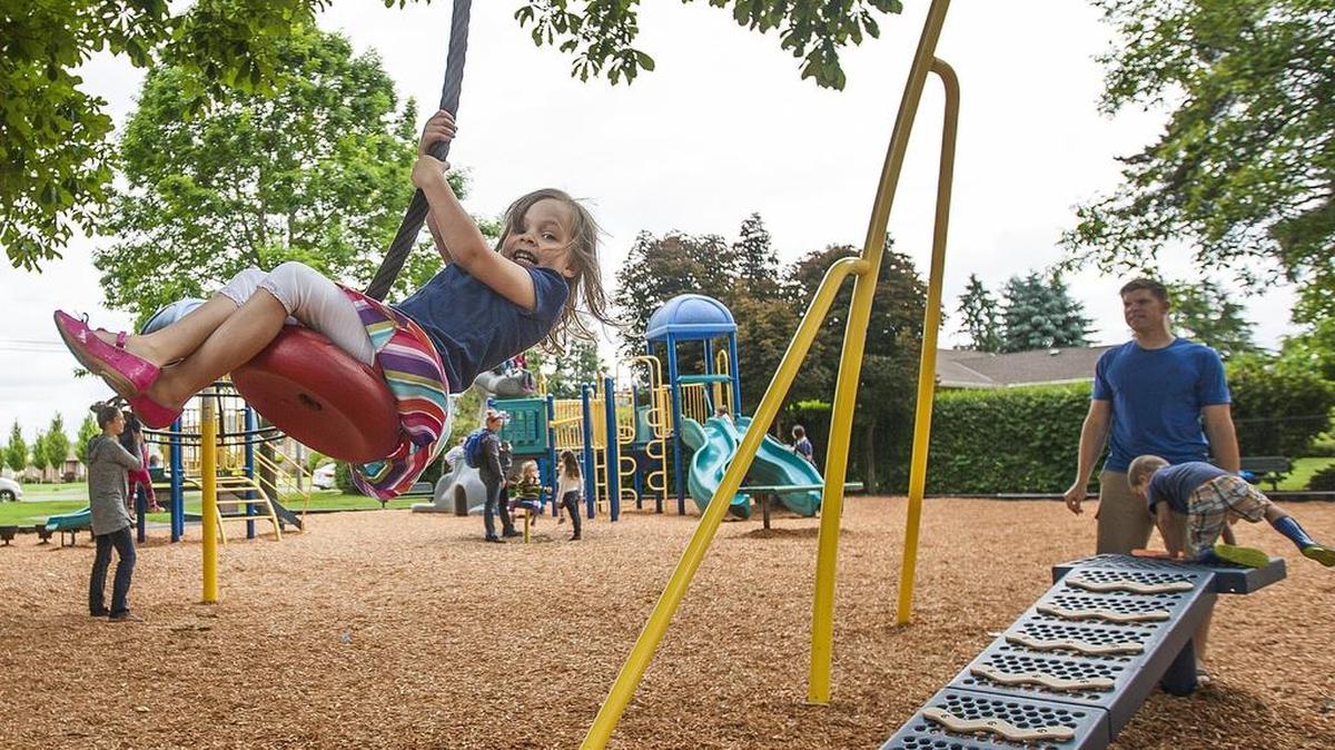 Savannah Hart, 4, swings on the zip line ride at Loyalty Park in Sumner. The city is setting a future goal to have a neighborhood park within a quarter-mile walking distance of residences.