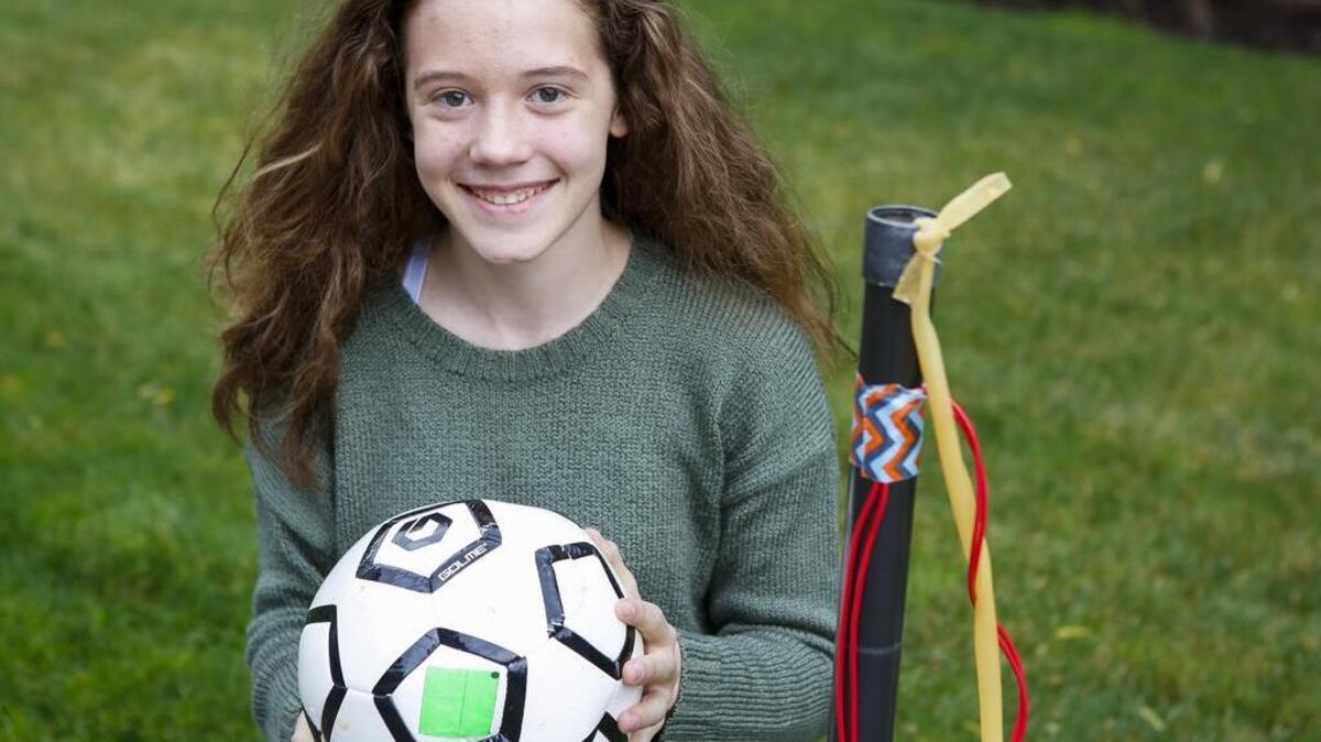Amelia Day holds up her “Pressure Soccer Ball” invention at her home in Sumner. While the invention was originally intended as a soccer aid, Day soon discovered it can be used to help those in need of physical therapy. Her idea started in Nov. 2015 for a class science project and evolved into a prototype that she presented at Discovery Education’s 3M Young Scientist Challenge final event in St. Paul, Minnesota.