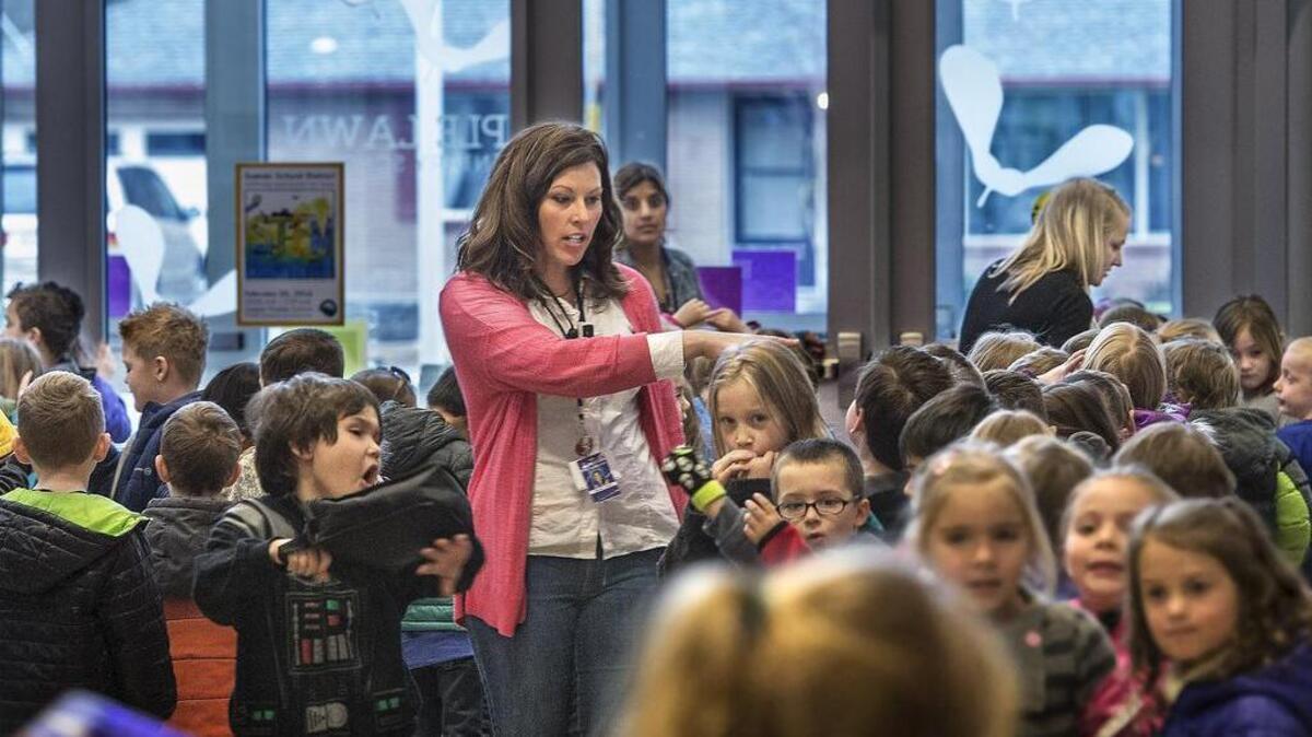 Maple Lawn Elementary School kindergarten teacher Heather Elwell accounts for students before they go out for recess. October is National Bullying Prevention Month, but in the Sumner School District prevention begins in kindergarten.