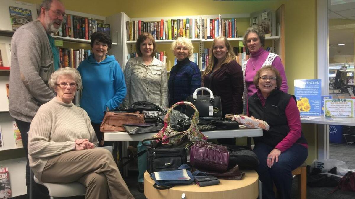 From left, Friends of the Sumner Library members Tim Majoch, Marsha Lindberg, Sharon McDowell, Paulette Bridges, Margo Stewart, Miranda Lucker, Judy Levy and Linda Sader gather for a meeting on Feb. 28 to discuss the group’s upcoming book sale.