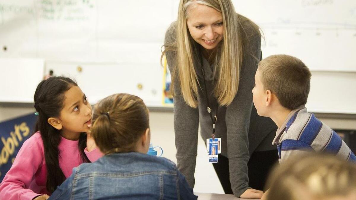 Tricia Hukee goes over division problems with students last week while teaching math at Daffodil Valley Elementary in Sumner. Hukee is a finalist for the Presidential Award for Excellence in Mathematics and Science Teaching.