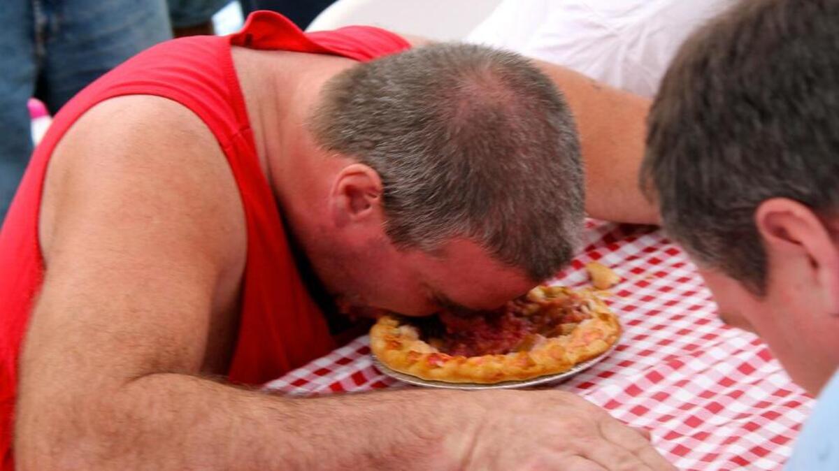 Adult division pie-eating contest winner Paul Puskar stuffs his face devouring his rhubarb pie and proudly winning the contest during the 2012 event at Rhubarb Days in Sumner. Rhubarb Days returns Saturday (July 15) and Sunday (July 16).
